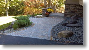 front entry with brick pavers, planting and boulder outcroppings