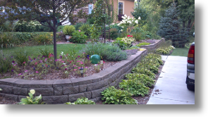 small retaining wall and steps for extra parking area